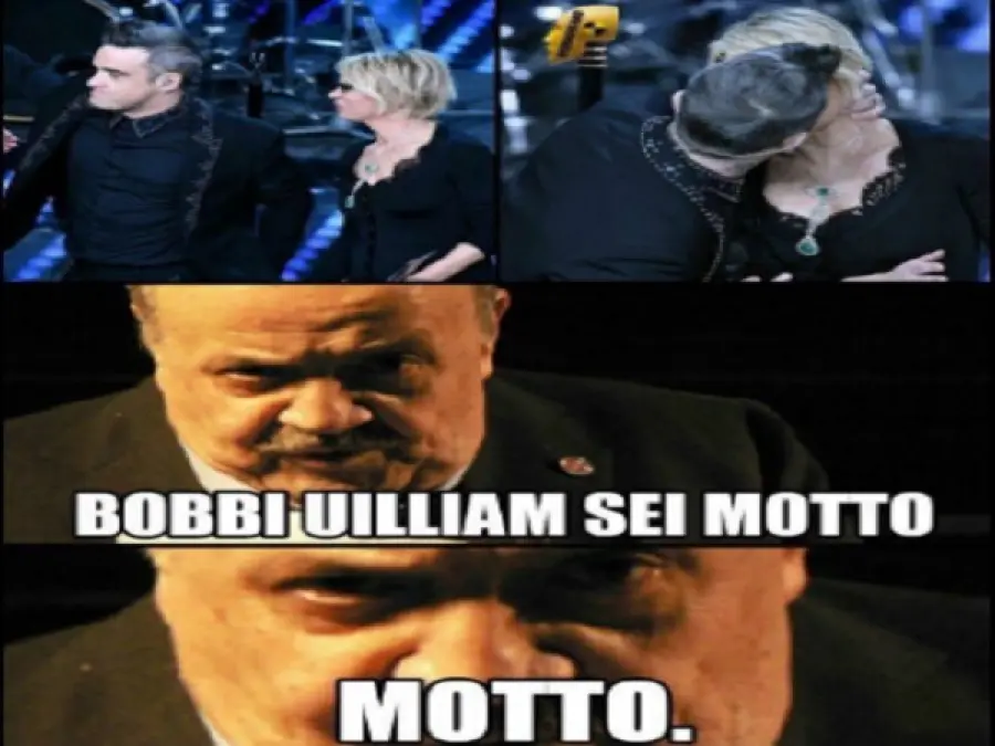 Sanremo 2017 seconda serata il bacio tra Robbie Williams e Maria De Filippi fa nascere l'ironia sul social per Maurizio Costanzo